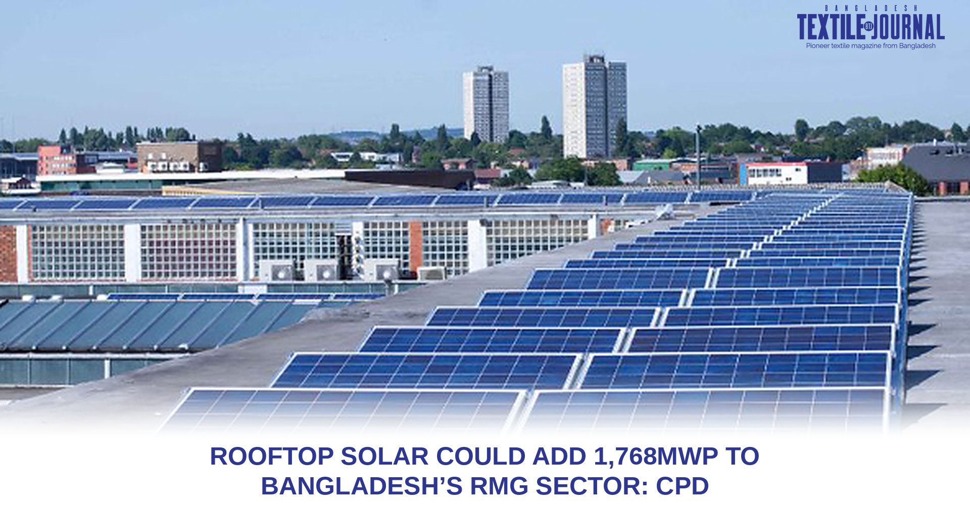 Rows of solar panels installed across an industrial factory rooftop