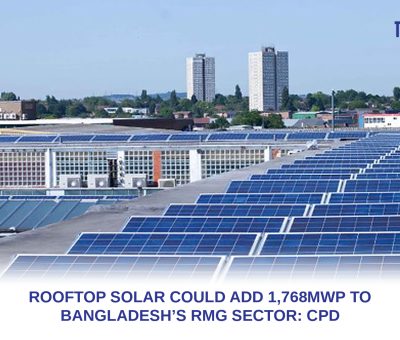 Rows of solar panels installed across an industrial factory rooftop