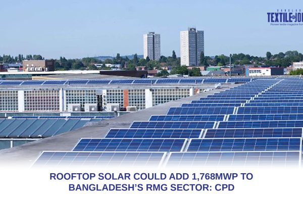Rows of solar panels installed across an industrial factory rooftop