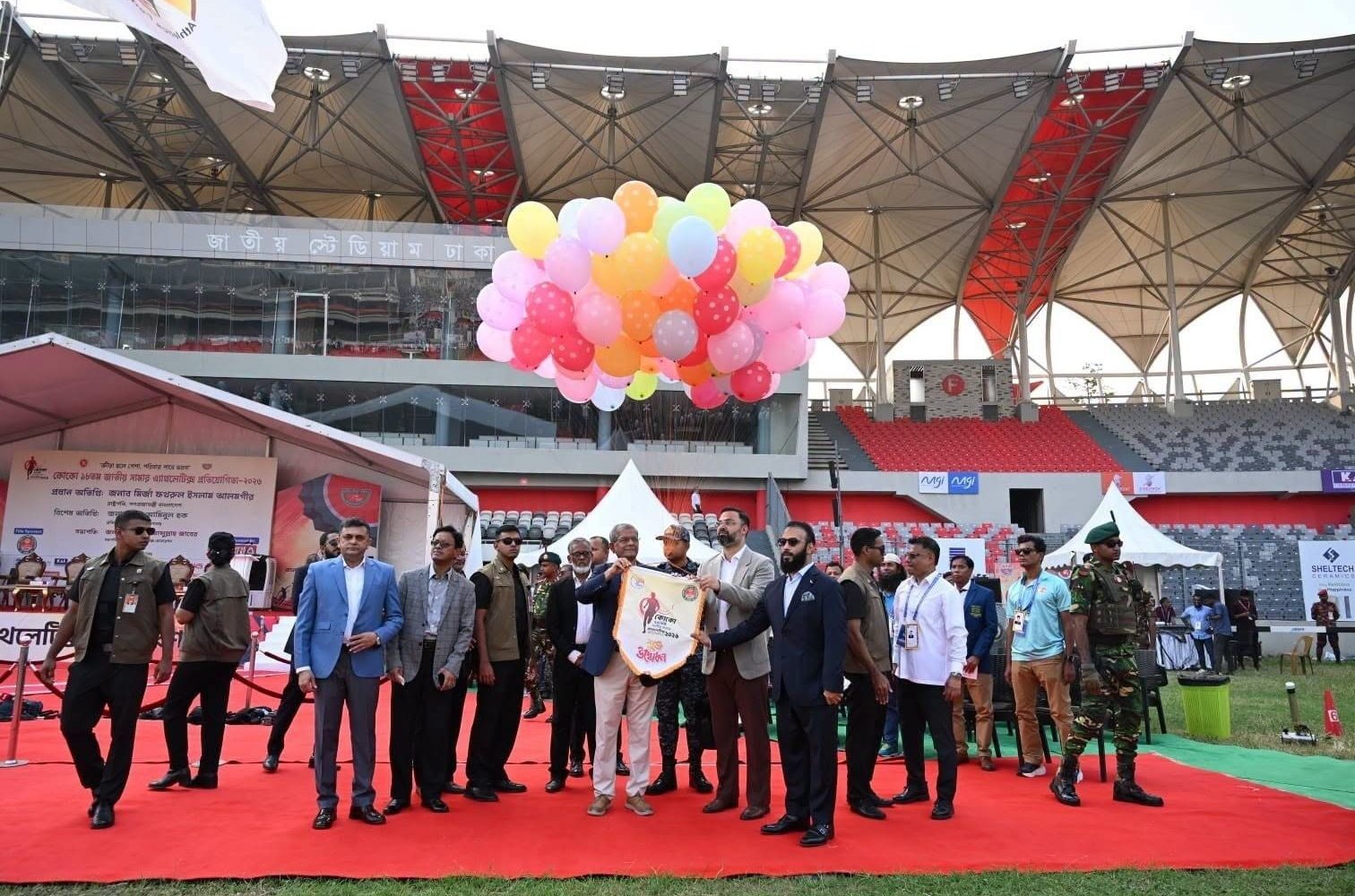 Image Alt Text: Athletes compete at the 18th COCO National Summer Athletics Competition at Dhaka National Stadium, Bangladesh.