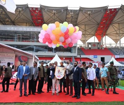 Image Alt Text: Athletes compete at the 18th COCO National Summer Athletics Competition at Dhaka National Stadium, Bangladesh.